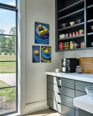Sunlit corner pantry with modern cabinetry and vibrant wall art in a custom home in Charlotte, NC by Simonini Homes