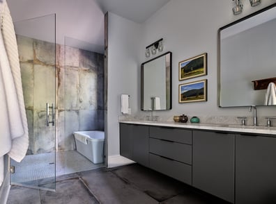 Contemporary bathroom with dual vanity and large industrial shower in a custom home in Charlotte, NC by Simonini Homes