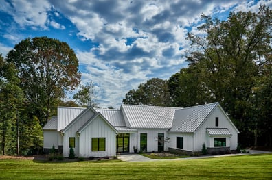 Modern farmhouse front exterior with board and batten siding of a custom home in Charlotte, NC by Simonini Homes