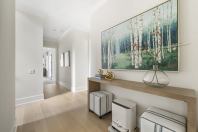 Interior hallway with accent art in custom Mooresville home by Simonini Homes