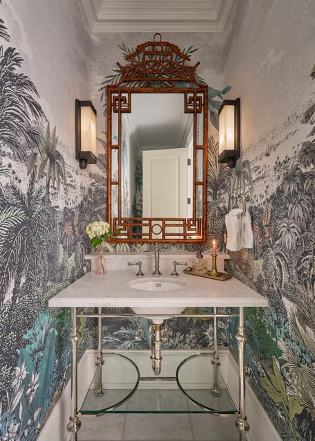 Botanical-themed powder room with intricate wallpaper and marble sink in a custom home in Eastover, Charlotte by Simonini Homes