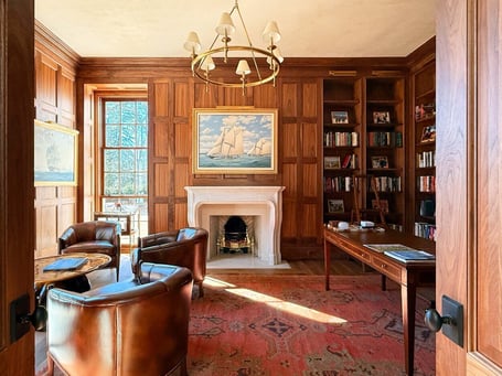 Classic study with built-in bookshelves and warm wood tones in a custom home in Eastover, Charlotte by Simonini Homes