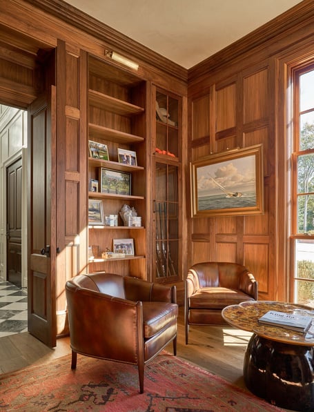 Comfortable seating in richly paneled home office in a custom home in Eastover, Charlotte by Simonini Homes