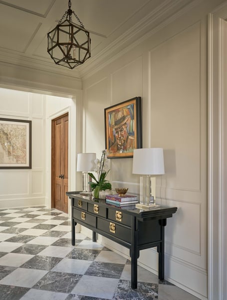 Decorated entry corridor featuring checkered floors in a custom home in Eastover, Charlotte by Simonini Homes