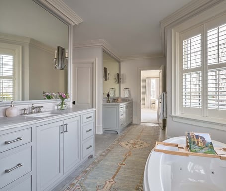 Double vanity bathroom with soaking tub and natural light in a custom home in Eastover, Charlotte by Simonini Homes