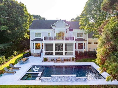 Backyard oasis with in-ground pool and screened porch from a renovation in Ballantyne, NC