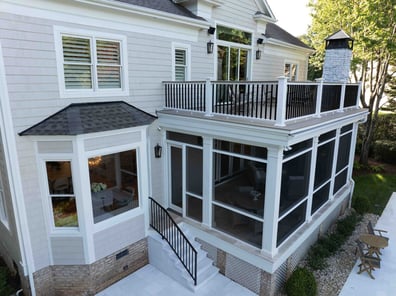 Exterior stairs leading to screened porch and elevated deck from a renovation in Ballantyne, NC