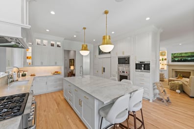 Open-concept kitchen with pendant lights and seating island from a renovation in Ballantyne, NC
