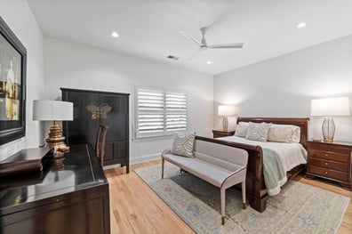 Traditional bedroom with dark wood furniture from a home renovation in Ballantyne, NC