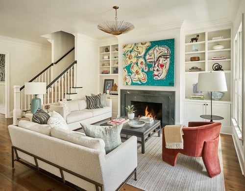 Bright living space with sculptural light fixture and artistic focal point in Charlotte home by Simonini Homes