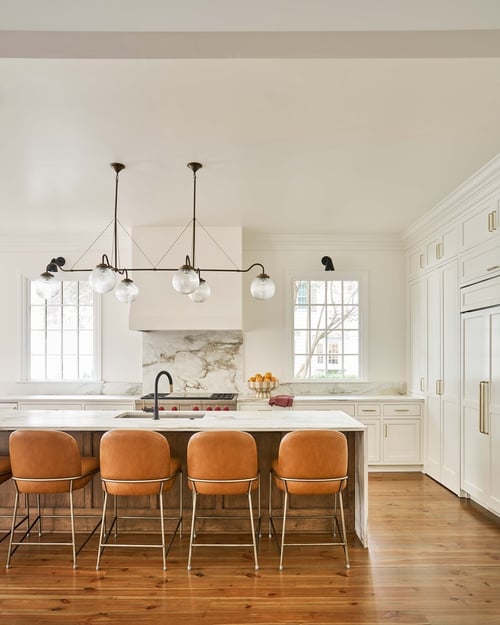 Charlotte, NC custom home kitchen with leather barstools and marble backsplash by Simonini Homes