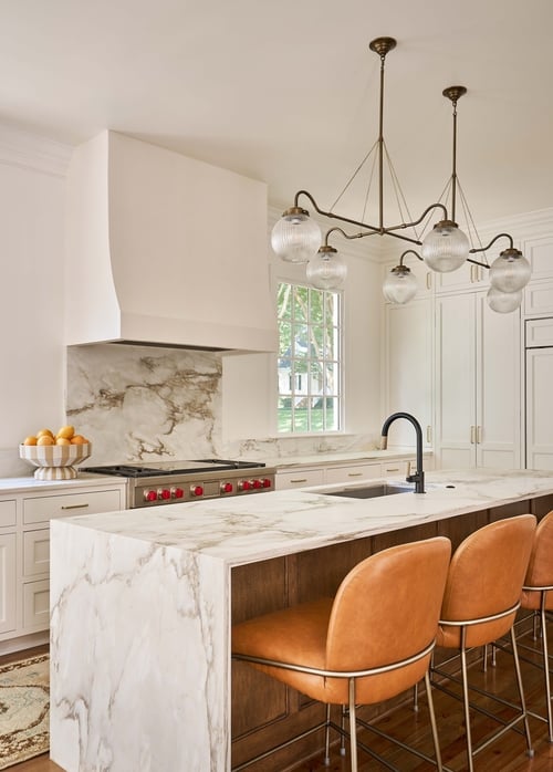 Detailed view of marble island and custom cabinetry in Charlotte kitchen remodel by Simonini Homes