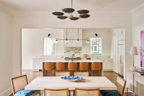 Open-concept kitchen and dining area in a Charlotte custom home by Simonini Homes
