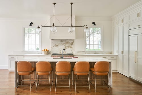Simonini Homes custom kitchen with white cabinetry and statement lighting in a Charlotte, NC home