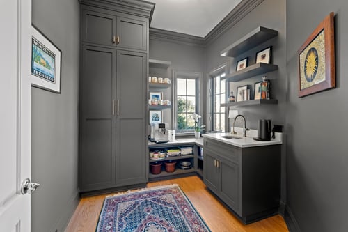 Dark cabinetry and compact beverage bar setup in a custom home in Charlotte, NC