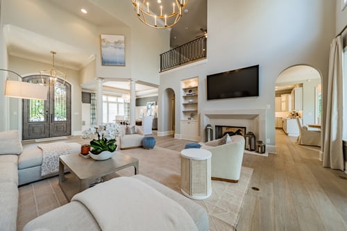 Inviting entryway and luxury living space with coffered ceilings in a custom home in Charlotte, NC