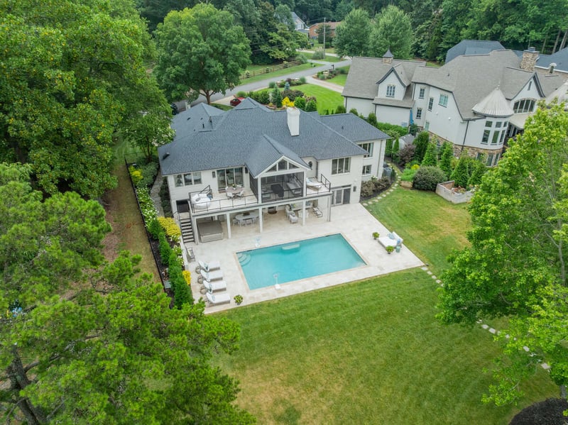 Aerial view of Simonini Homes custom build with pool and covered patio in Foxcroft, NC