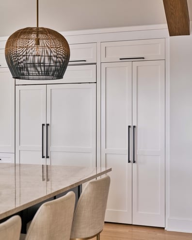 Closed pantry cabinetry in a seamless Simonini Homes kitchen design in Durham, NC