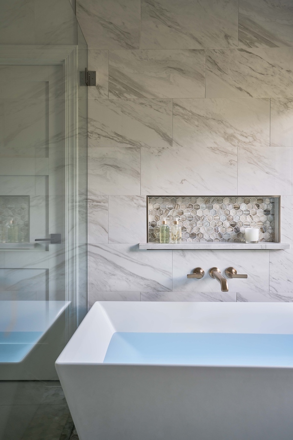 Freestanding soaking tub with tile backsplash in a Simonini Homes bathroom remodel in Mooresville, NC Freestanding soaking tub with tile backsplash in a Simonini Homes bathroom remodel in Mooresville, NC