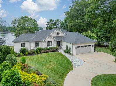 Front elevation of custom white brick home by Simonini Homes on Lake Norman in Waxhaw, NC