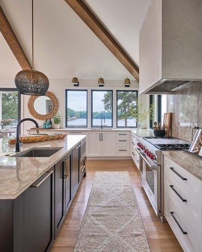 Kitchen galley view with marble countertops and scenic windows in a Simonini Homes custom home in Eastover NC
