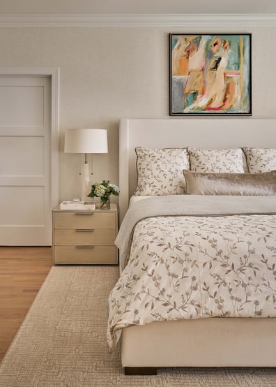 Luxurious master bedroom with abstract art and custom bedding by Simonini Homes in Fort Lawn, NC