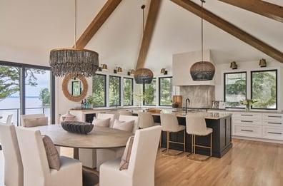 Open-concept kitchen and dining area with lake views in a Simonini Homes custom home in Weddington, NC