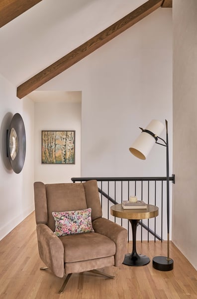 Relaxing corner with accent lighting and artwork in a Simonini Homes renovation in Weddington, NC