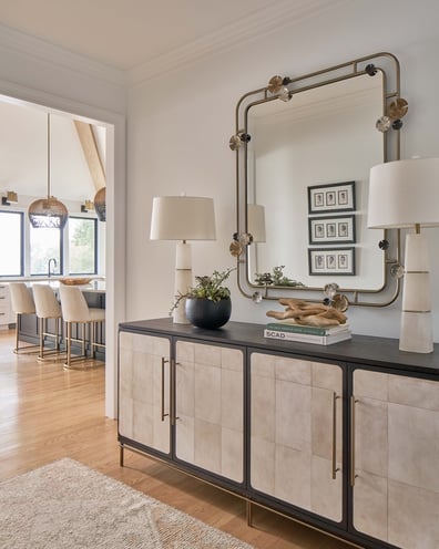 Transitional hallway with modern mirror and console in a Charlotte-area custom build by Simonini Homes