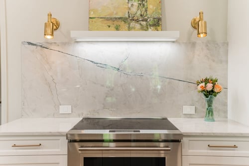 Symmetrical backsplash design and floral centerpiece in a Charlotte, NC renovation