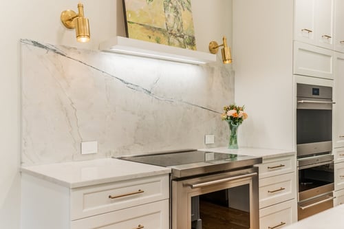 Wide marble backsplash and custom cabinets featured in a Charlotte, NC renovation
