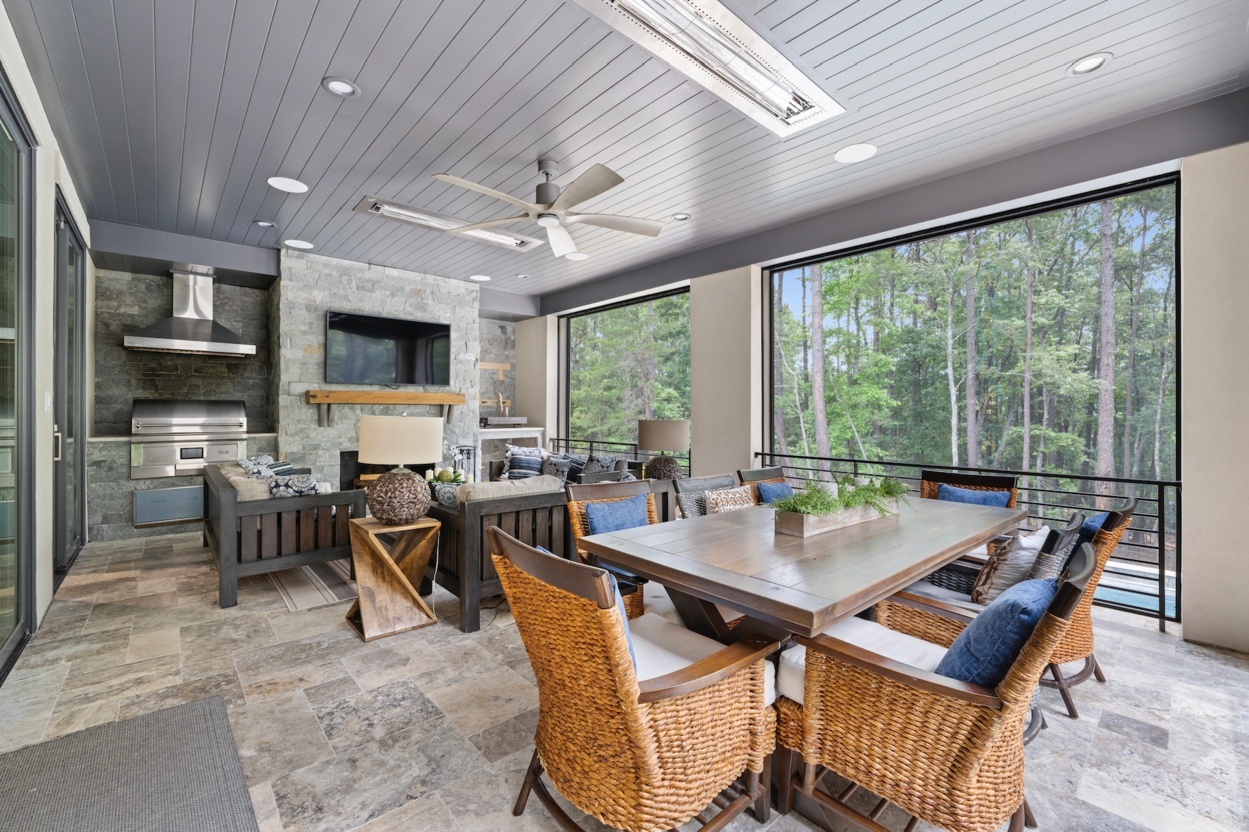 Covered screened in porch specialty project featuring grill and entertainment area in Charlotte, NC