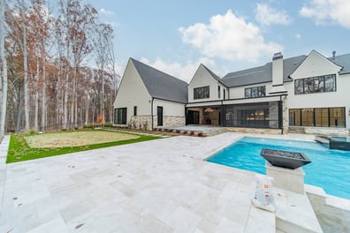 Luxury custom home backyard with pool and outdoor living by Simonini Homes in Waxhaw, NC-optimized