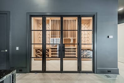 built-in wine storage room with glass doors in Waxhaw, NC custom home by Simonini Homes-optimized
