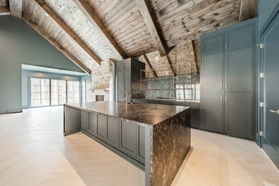 custom kitchen island with built-in appliances and open living area by Simonini Homes in Waxhaw, NC-optimized
