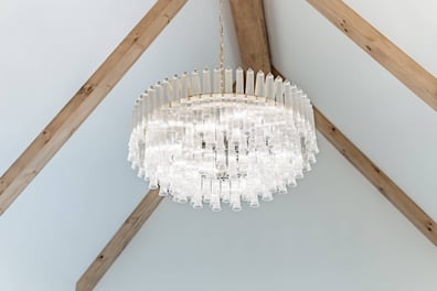 decorative glass chandelier under exposed beams in custom home by Simonini Homes in Waxhaw, NC-optimized