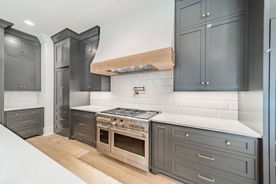 luxury kitchen cooktop area with tile backsplash in custom home by Simonini Homes in Waxhaw, NC-optimized