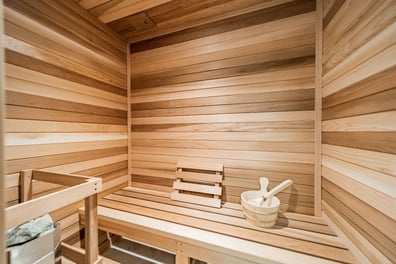 luxury sauna room with wood paneling and seating in a Simonini Homes custom home in Waxhaw, NC-optimized