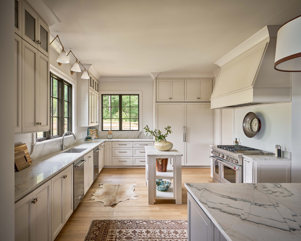Elegant kitchen design featuring dual islands in custom hunting lodge by Simonini Homes in Fort Lawn, NC